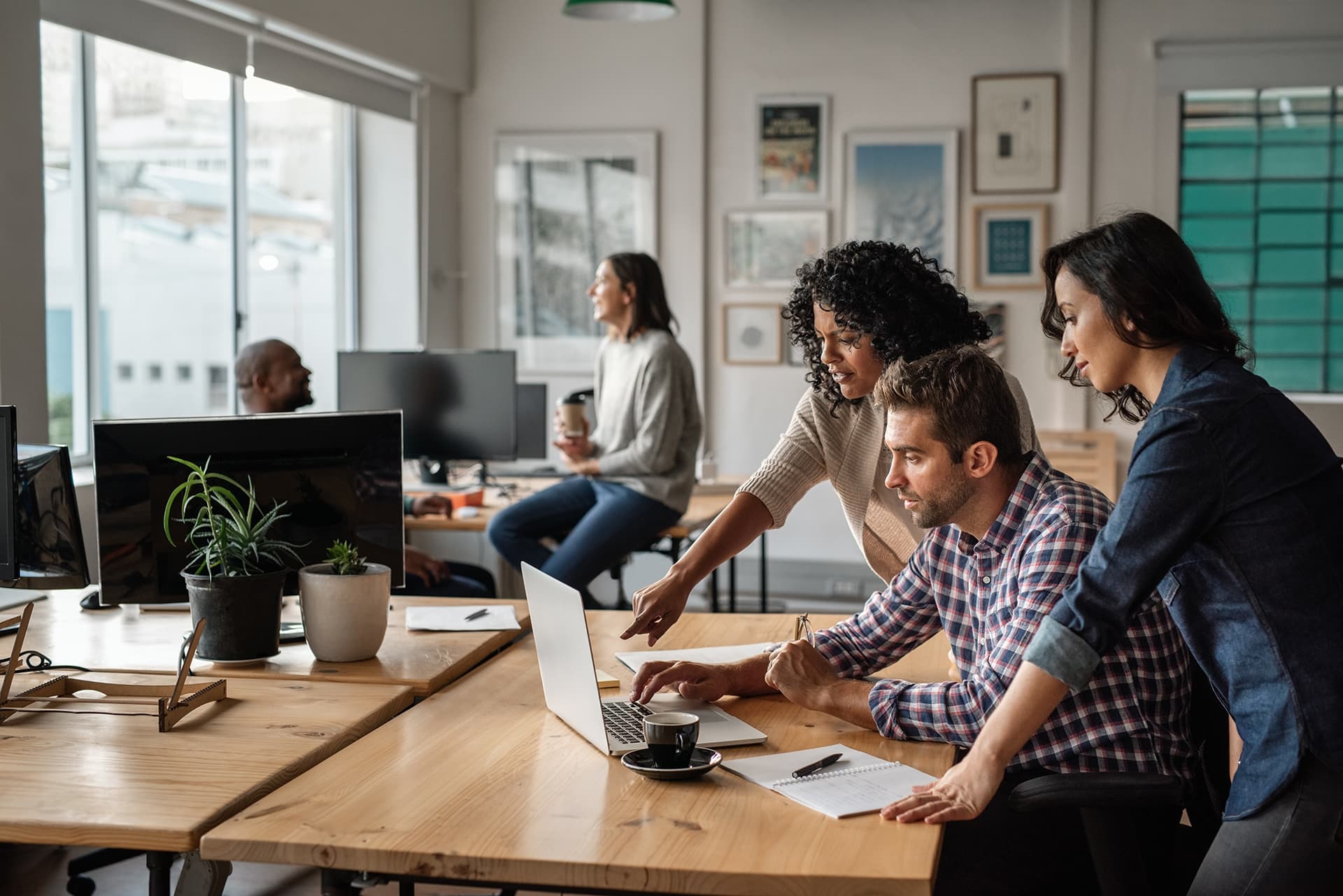 Three employees using a AI together at work